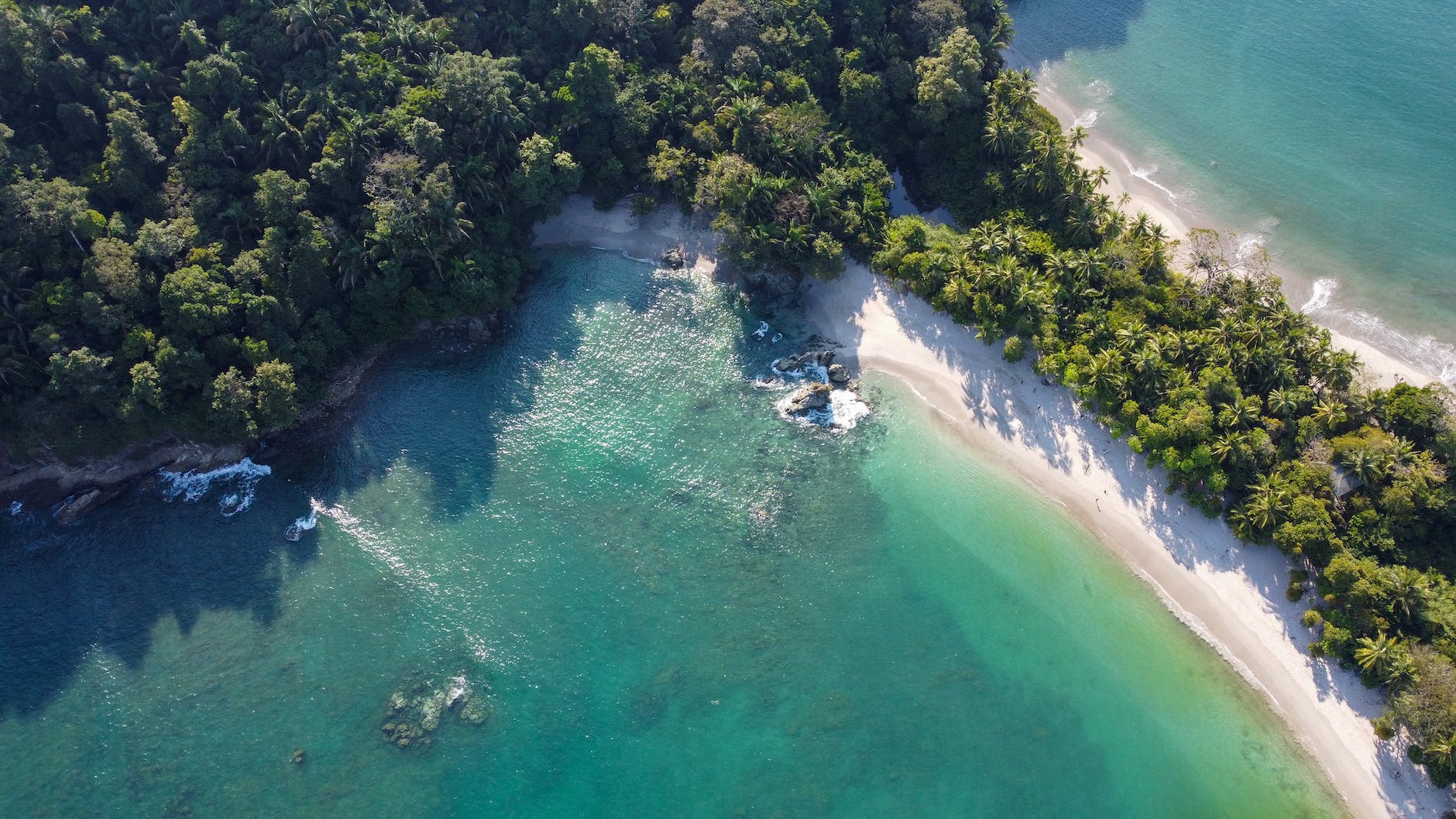 an aerial shot of the manuel antonio beach in costa rica Best Countries to Live Abroad
