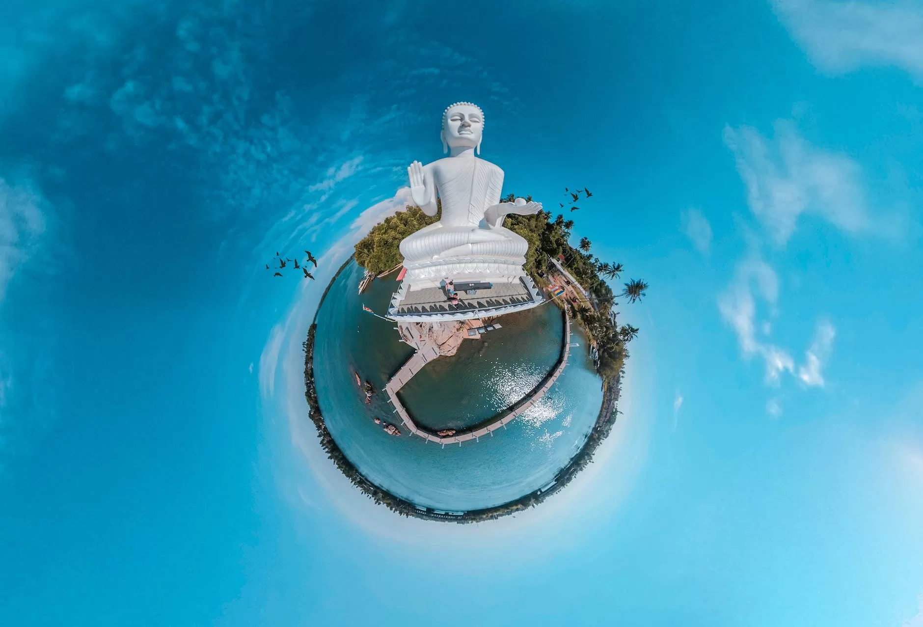 tiny planet photo and buddha statue