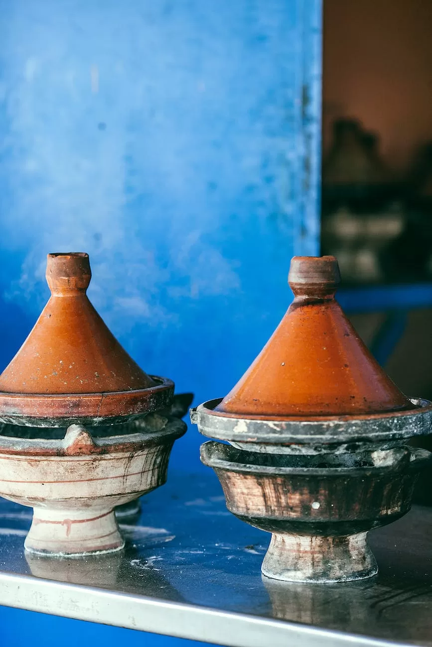 similar tagines on metal table in daylight
