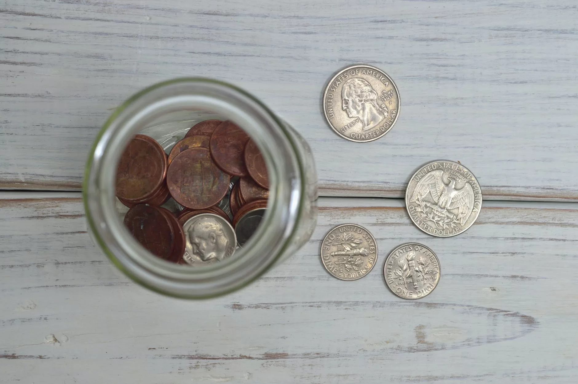 coins inside a non gangsta tip jar