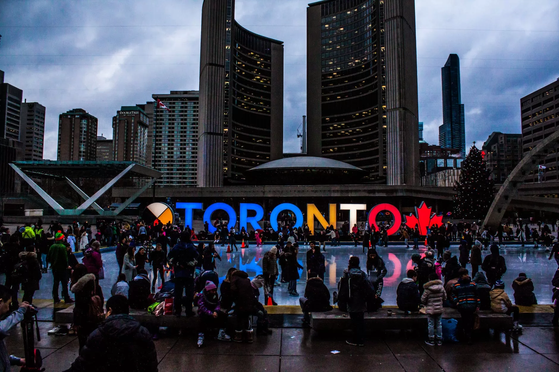 people gathered in front of toronto freestanding signage Canada digital nomad