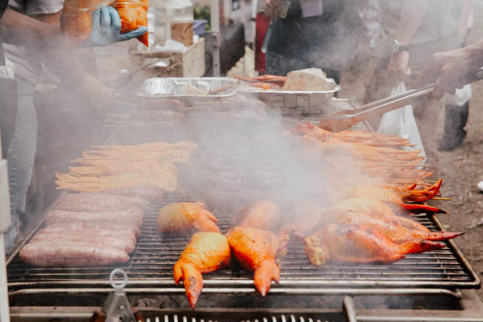 meat roasted on a grill at a street market