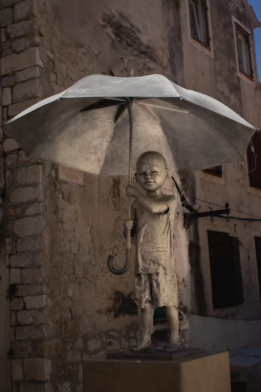 statue of boy with umbrella in sibenik