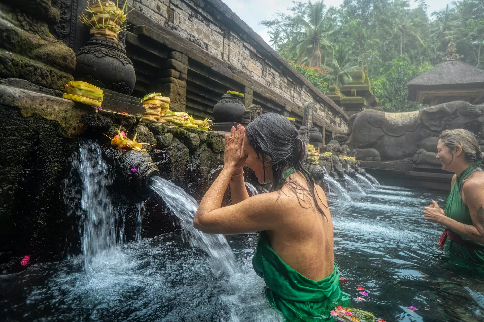 woman standing in front of flowing water