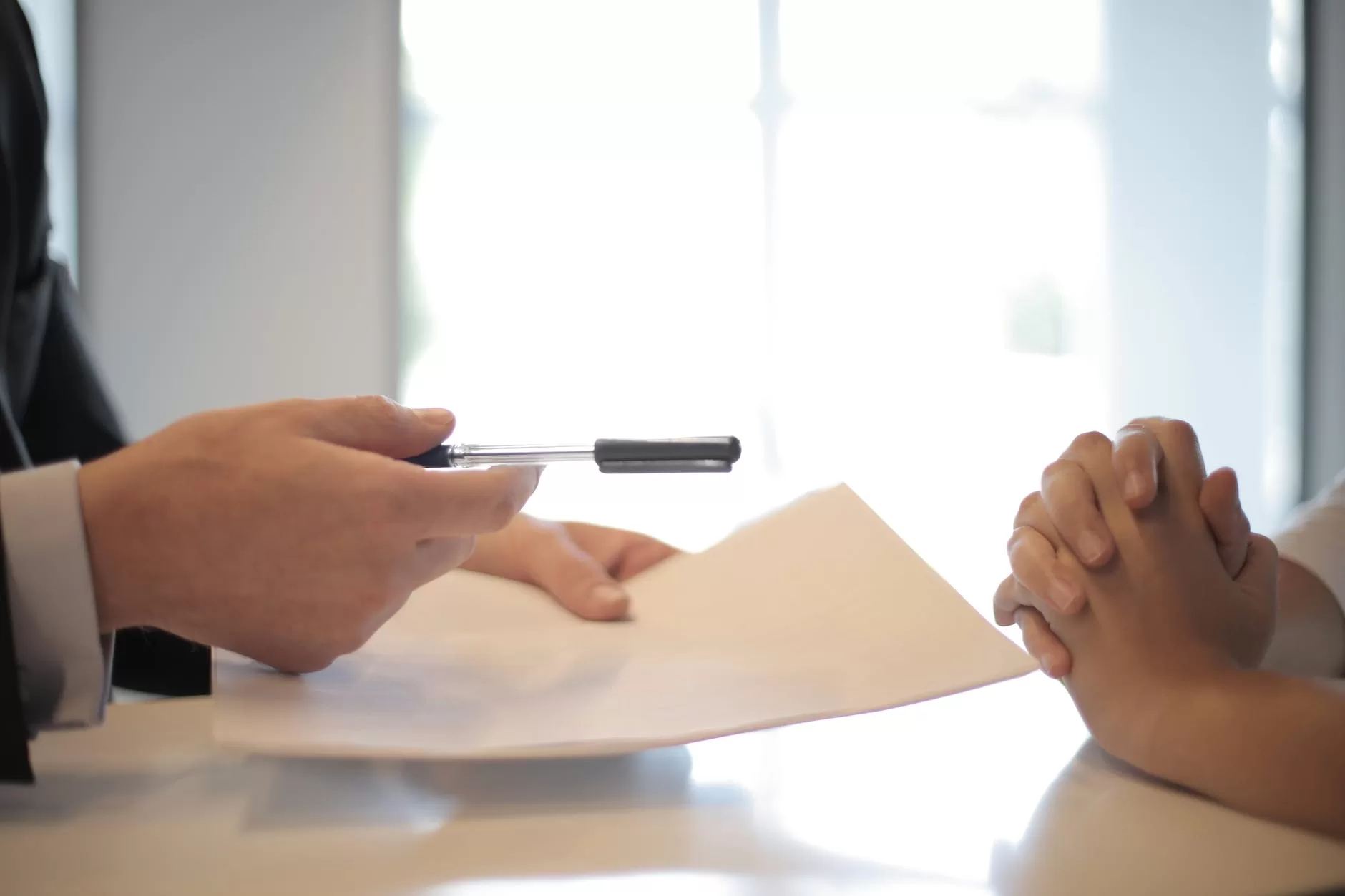 crop businessman giving contract to woman to sign