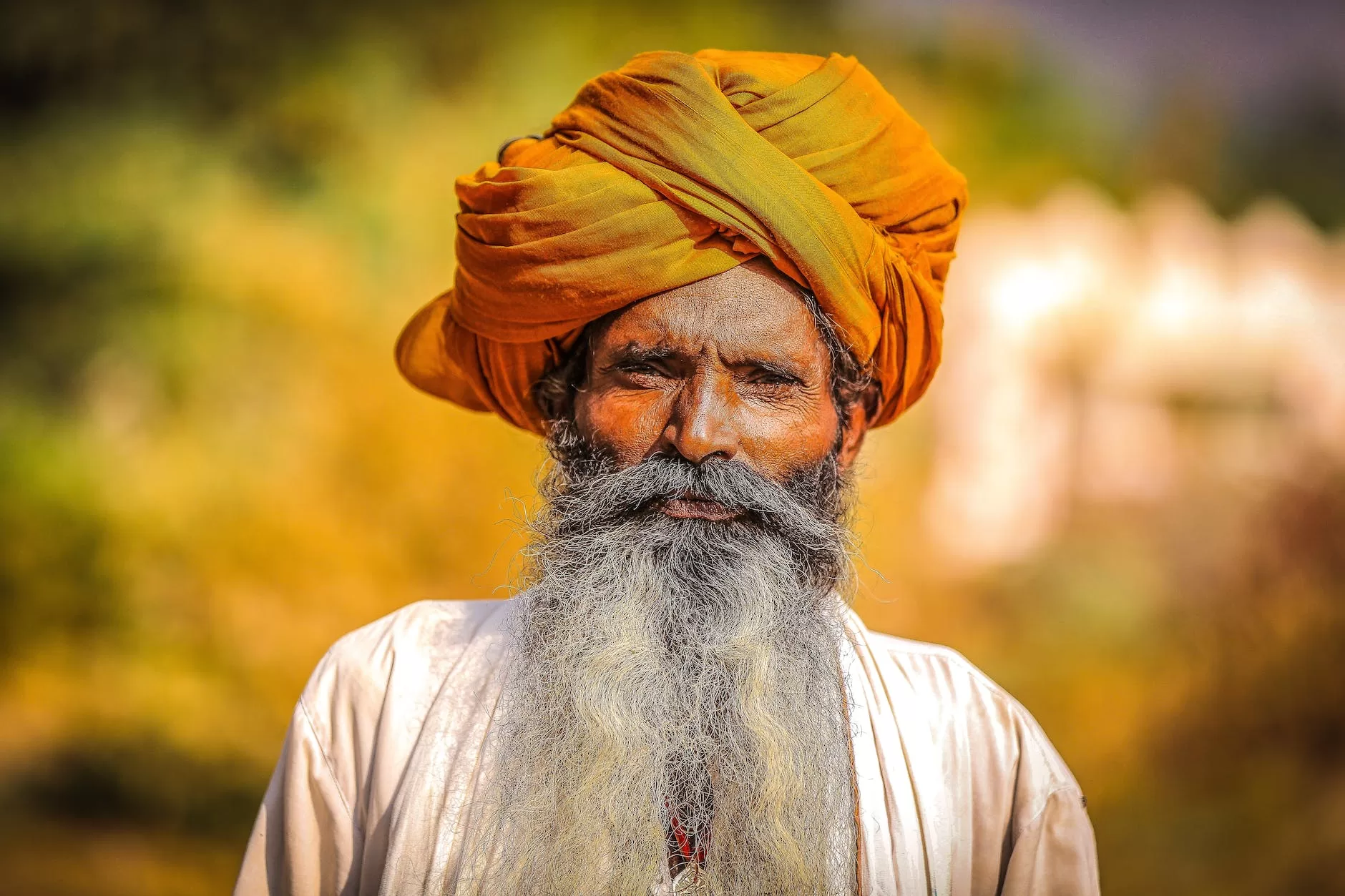 man wearing orange headdress