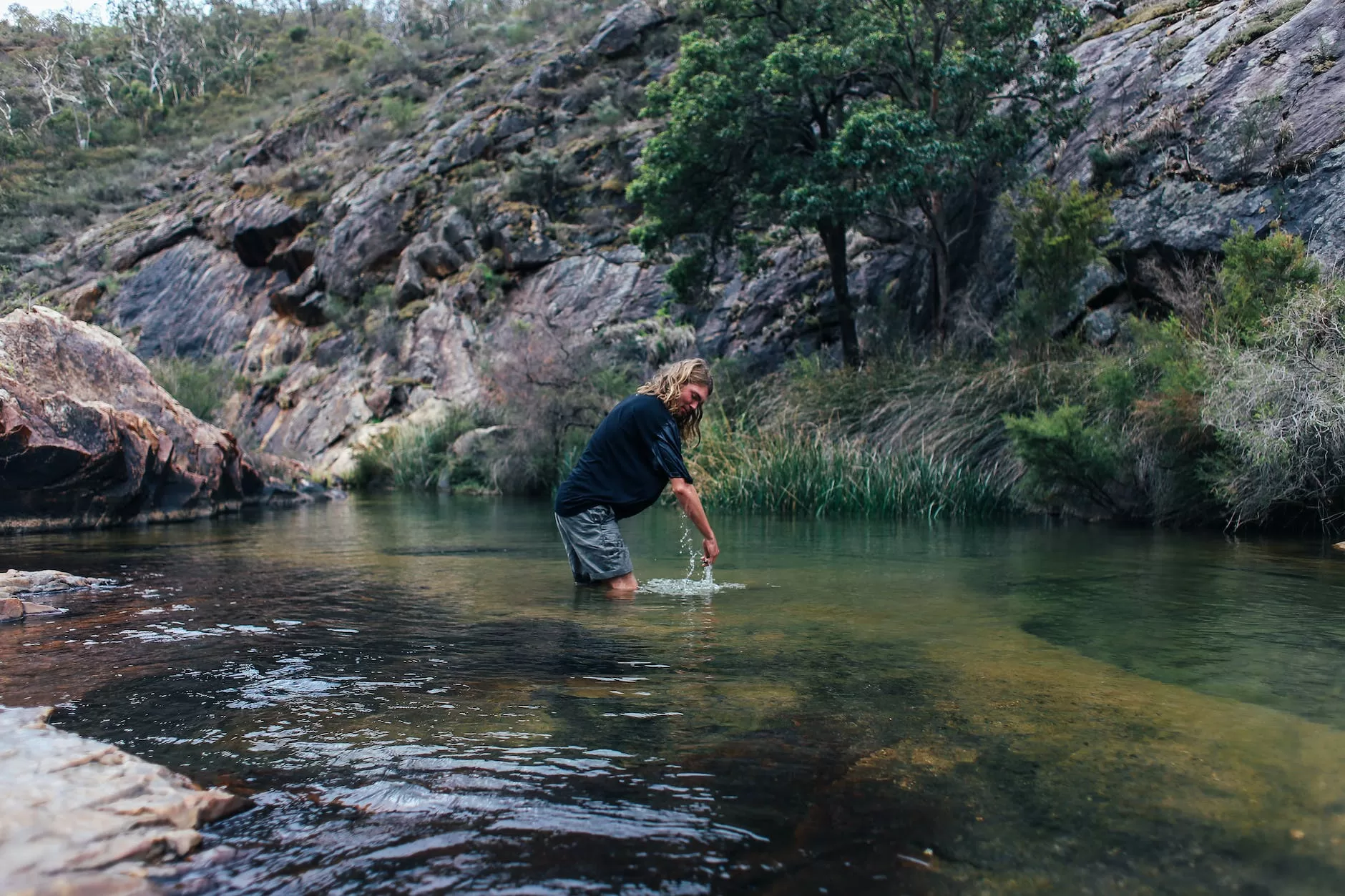 man standing in lake