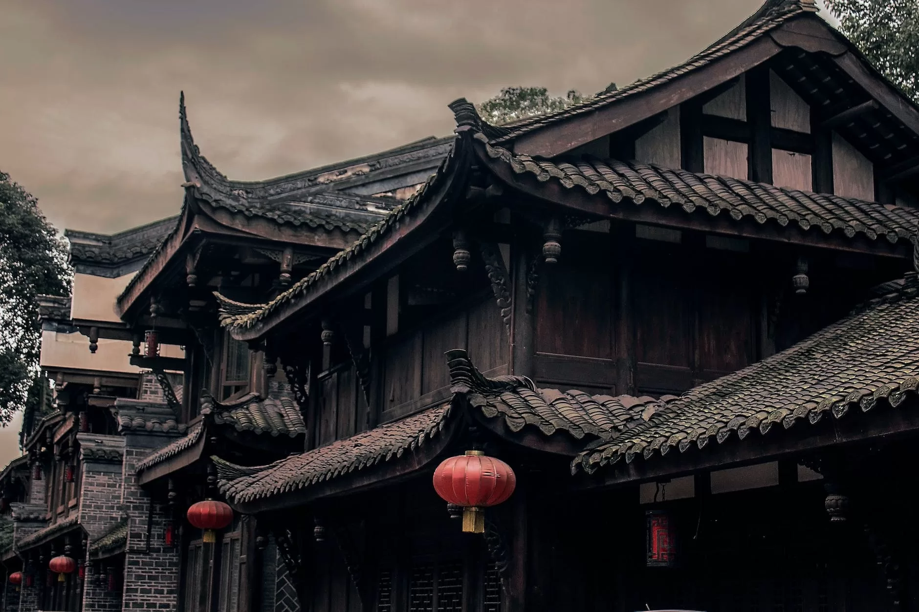 closeup photo of brown and black wooden houses  in southeast Asia