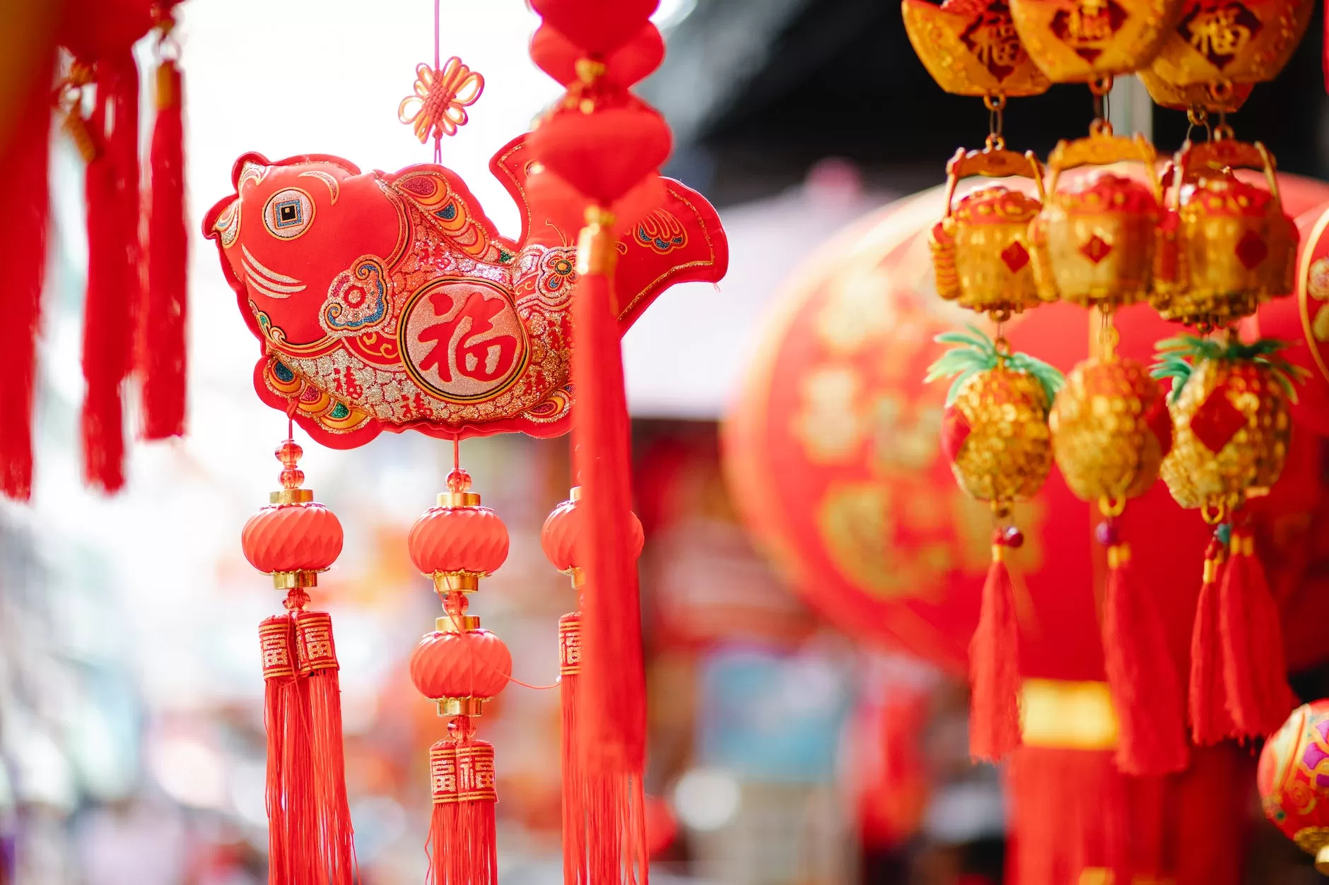 traditional oriental lanterns and decor hanging on street in Asia