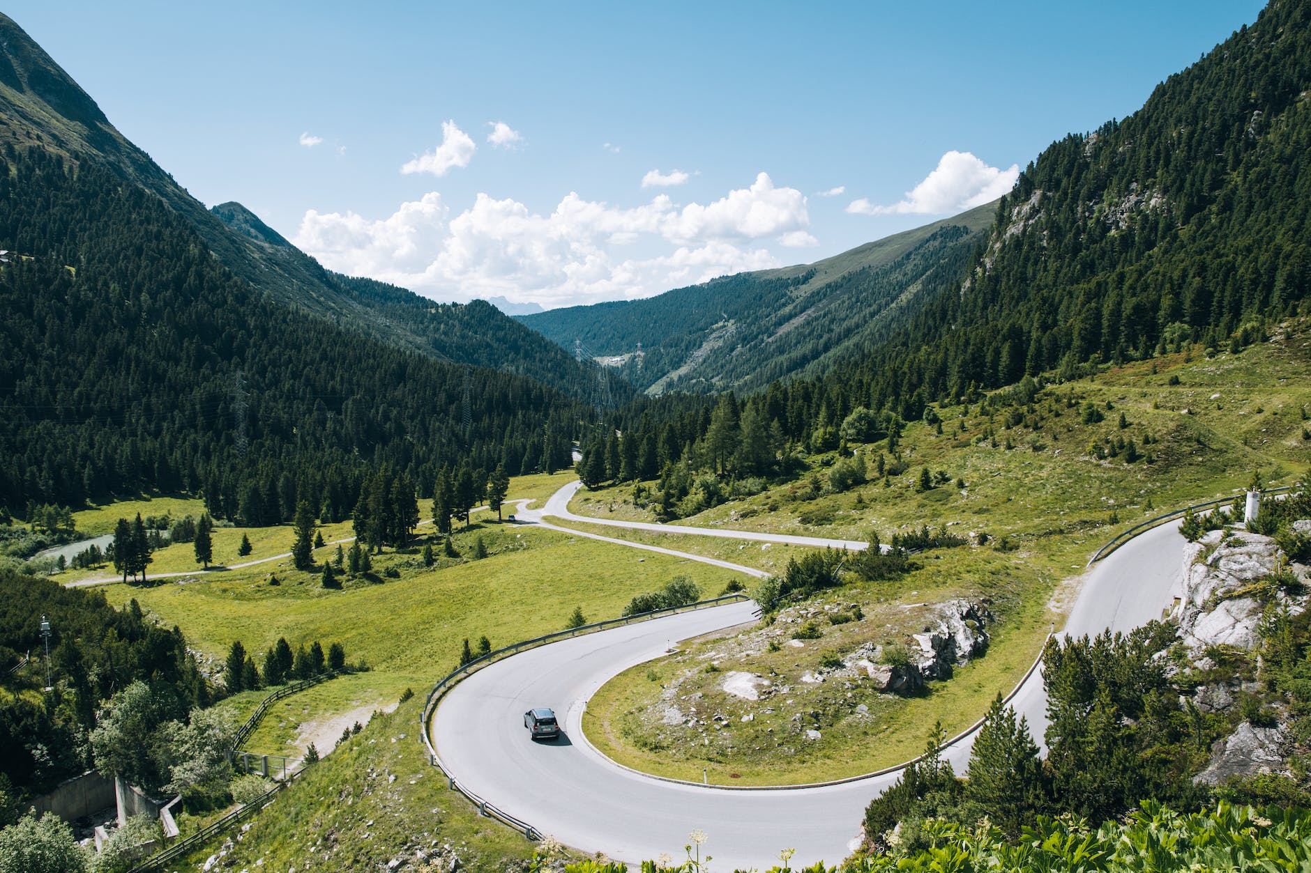 gray road and green mountains