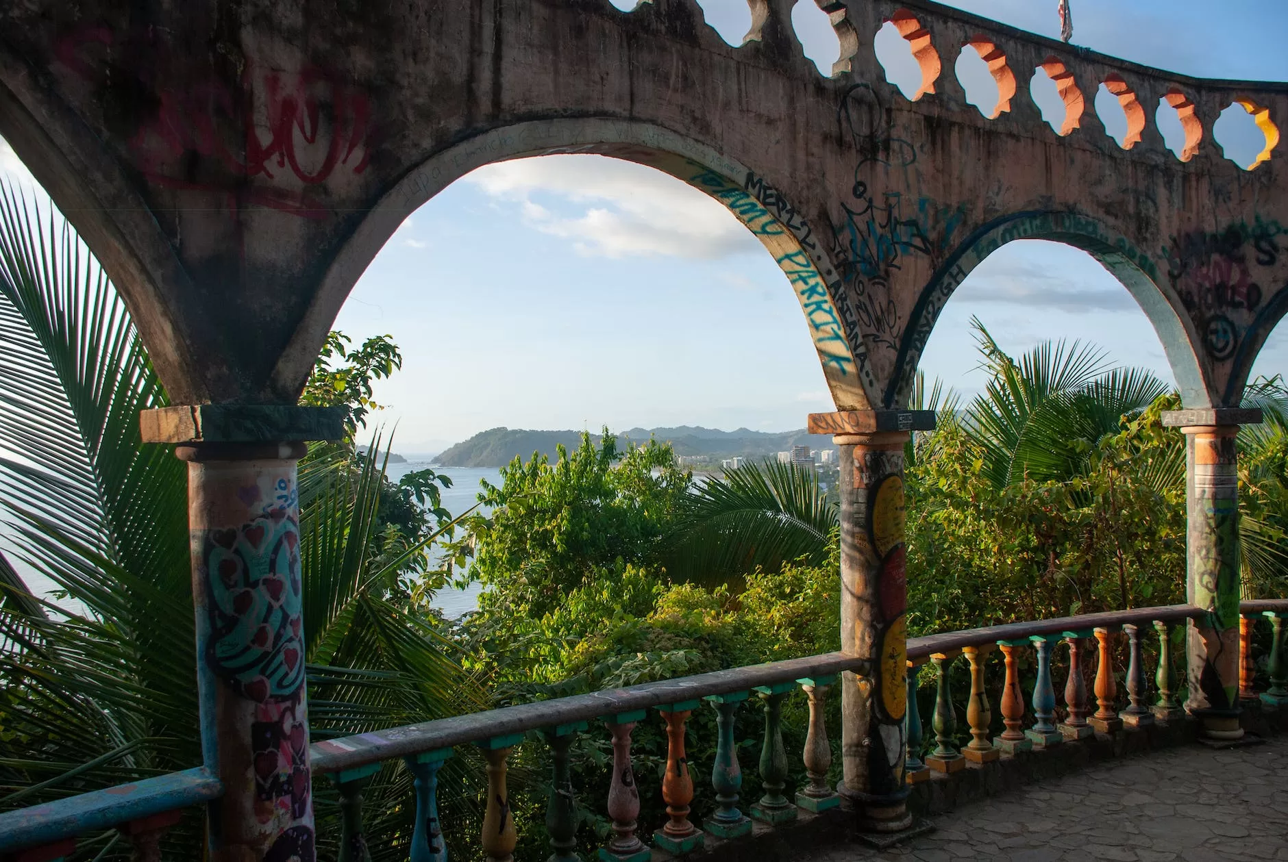 graffiti covered archs at a viewpoint in jaco costa rica