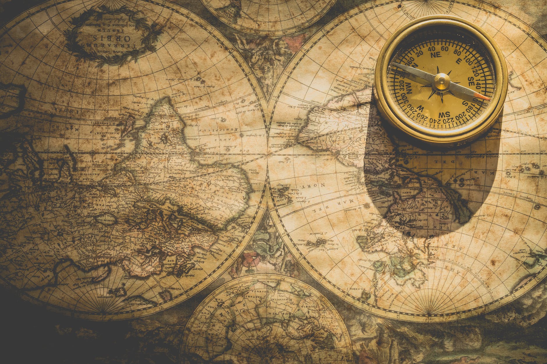 beige analog compass to navigate through Travel denial