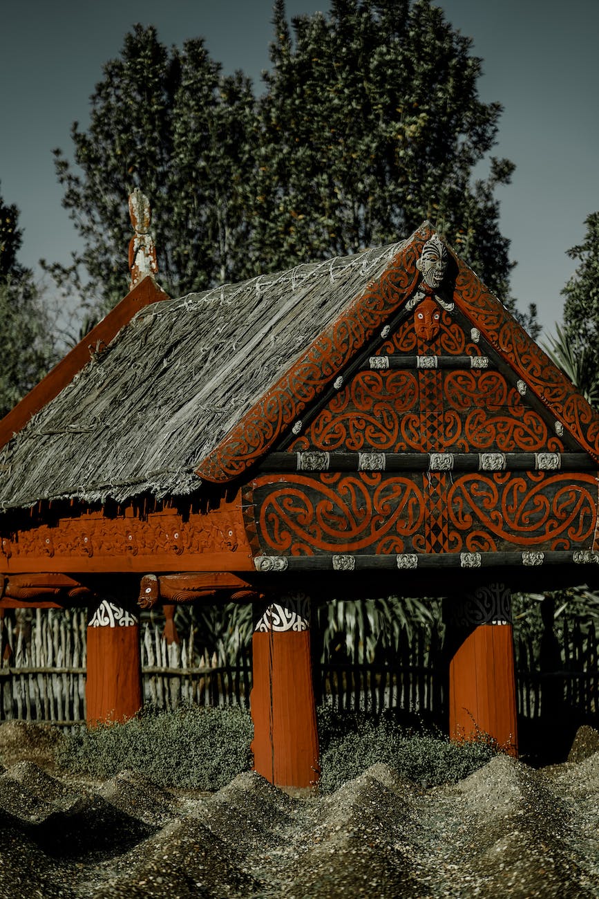 wood carvings on house with a garden Travel to Oceania