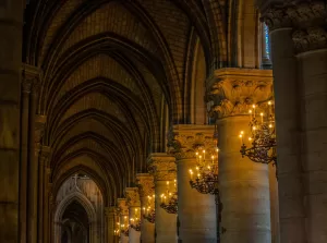 isle with lit chandeliers in between pillars where adventure awaits