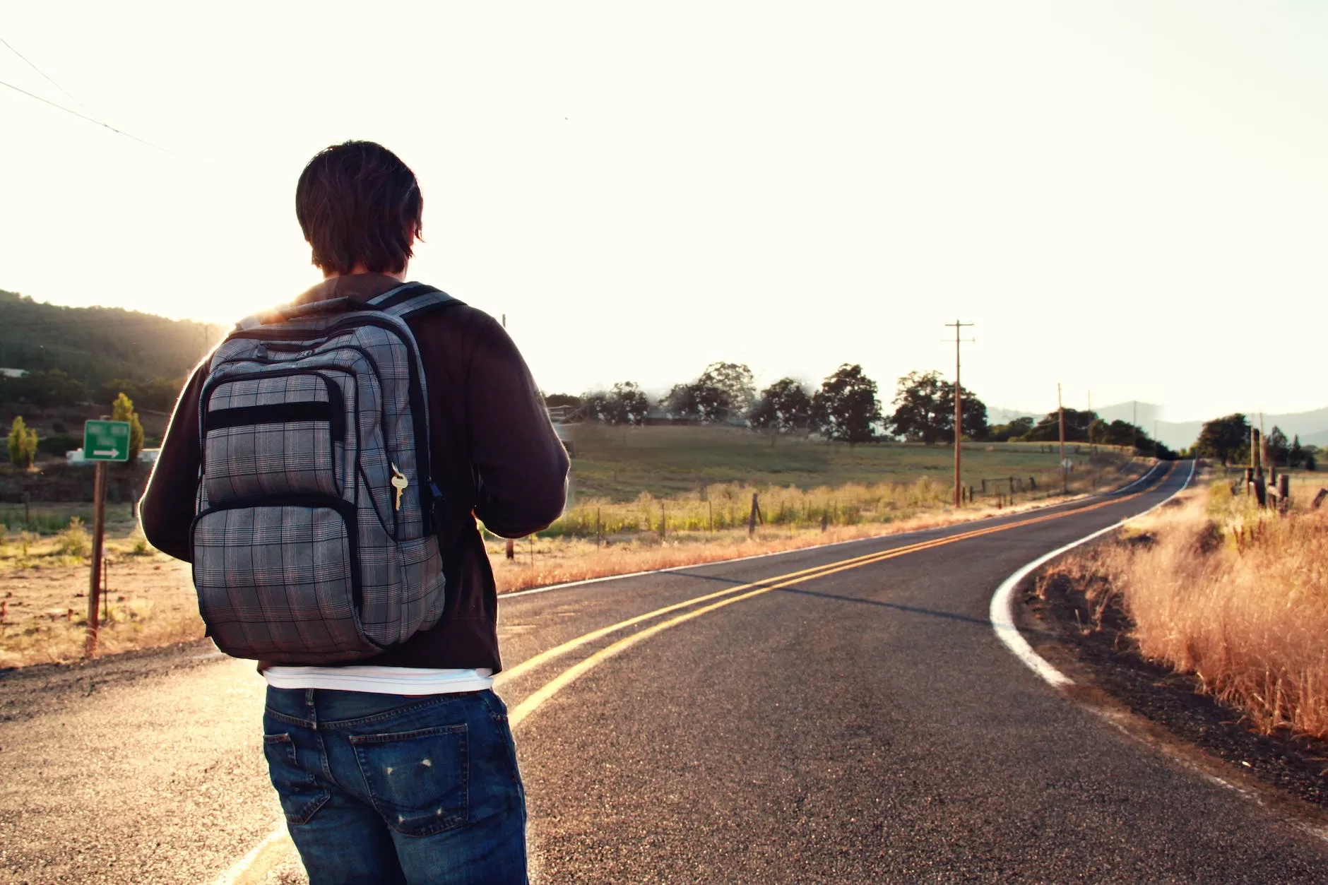 man facing road