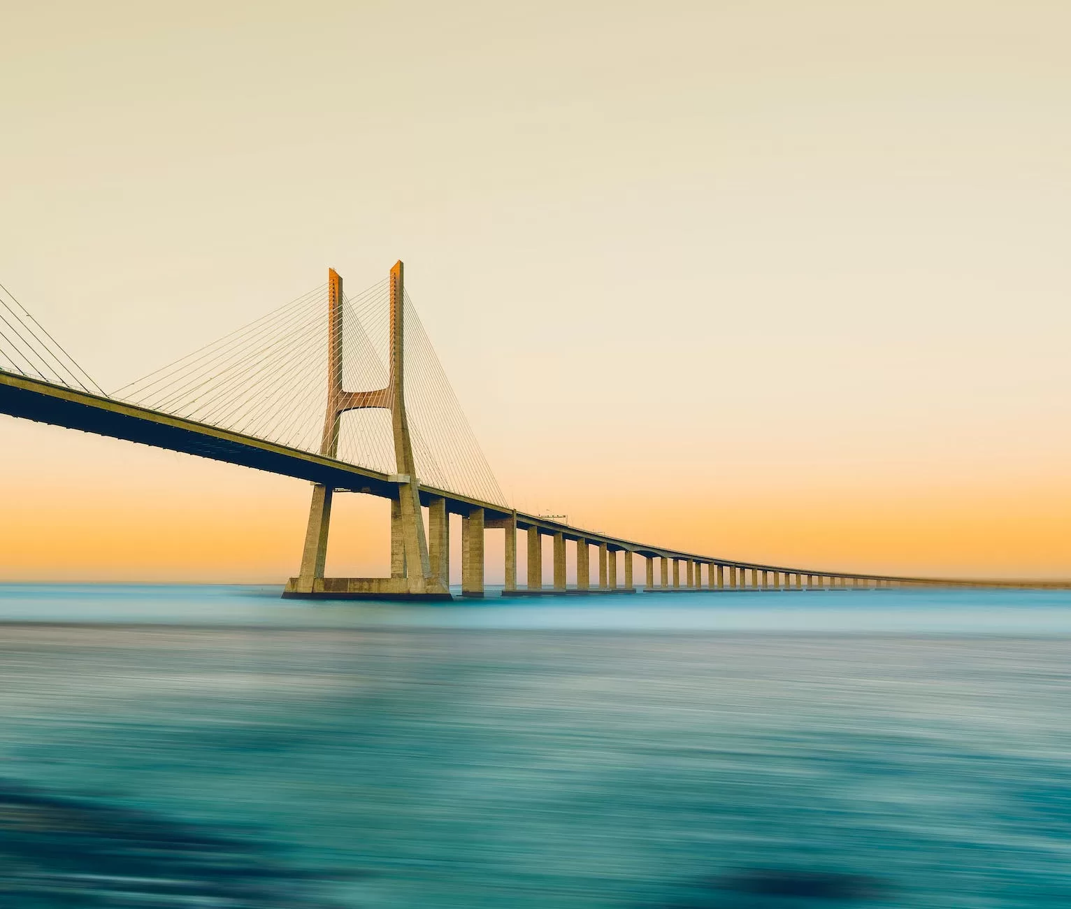 vasco da gama bridge at sunset