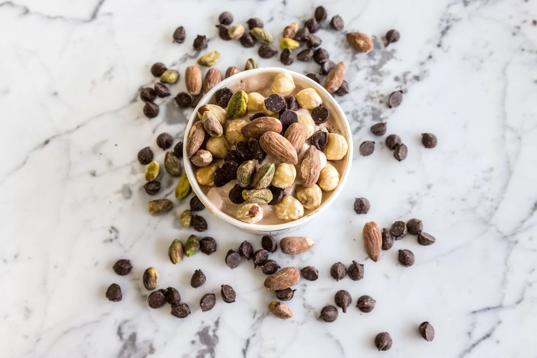 nuts in round white bowl health best travel tips