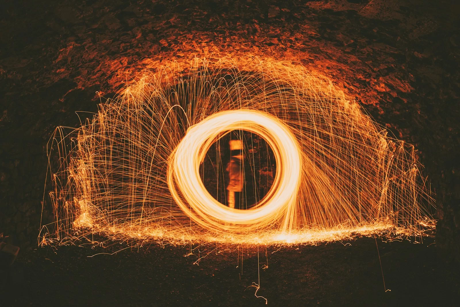 time lapse photography of person standing on tunnel
