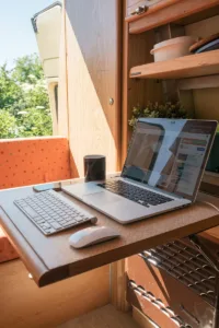 macbook pro on brown wooden table